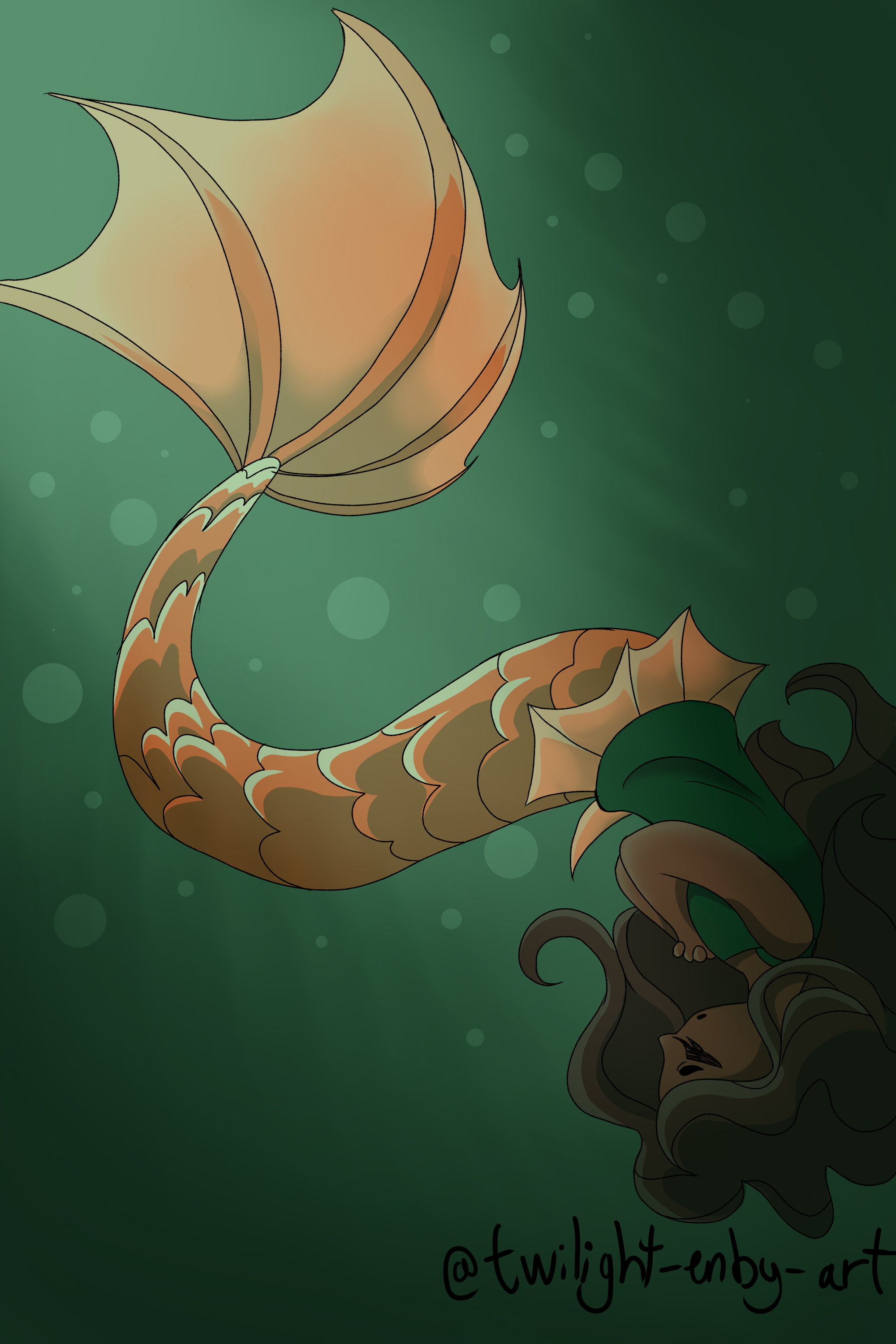 Mermaid floating upsidedown underwater